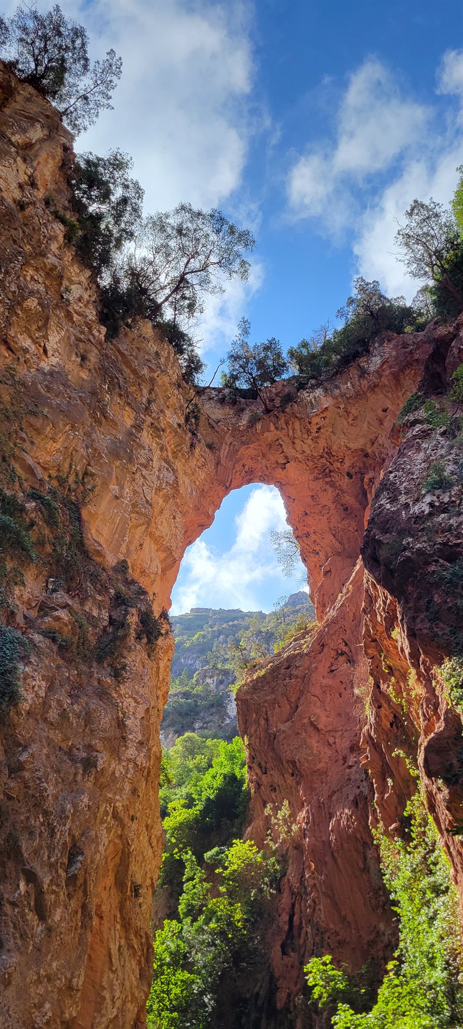 God’s Bridge, a vast natural rock arch above the Akchour river gorge