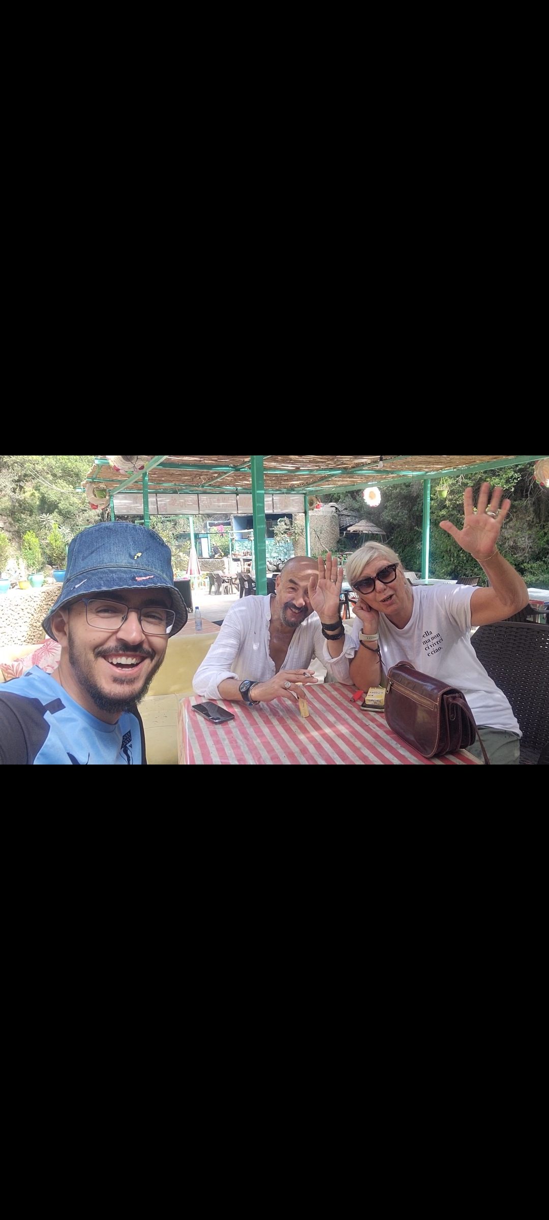 Tawfiq smiling with guests during a relaxed stop in Akchour