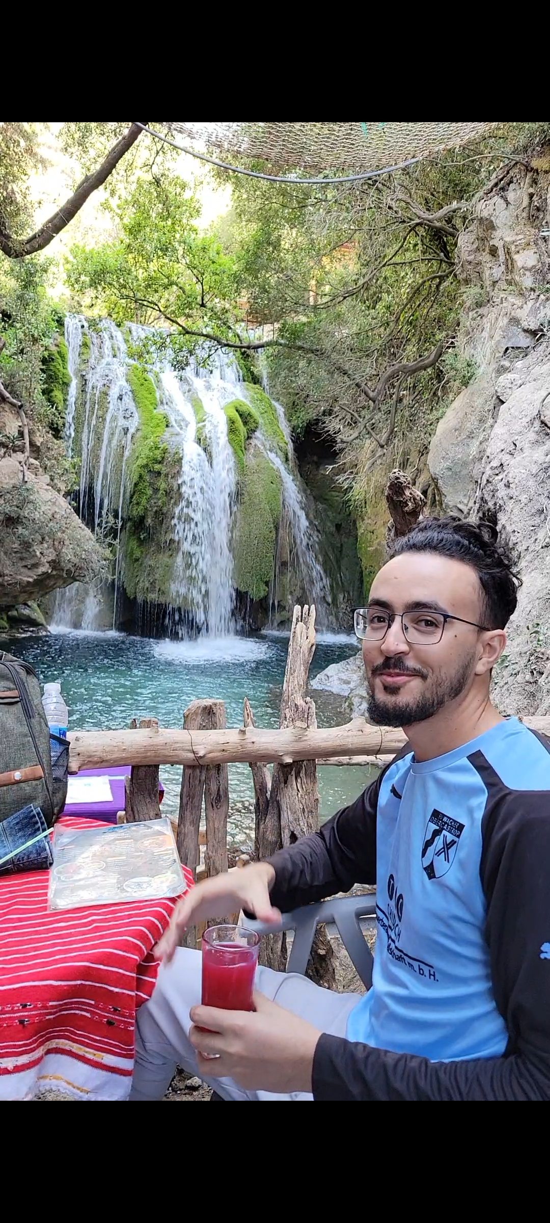 Tawfiq, a local hiking guide, beside the Akchour waterfalls